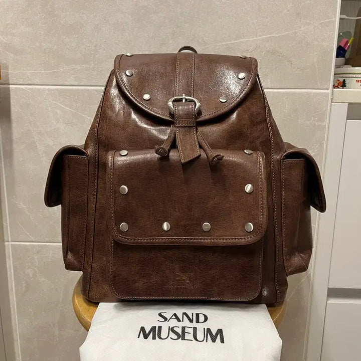 [BUNJANG] Sand Museum Studded Pocket Backpack / (땡처리)샌드뮤지엄 스터드 포켓백팩