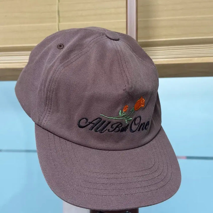 [BUNJANG] Allbutone Flower Logo Ball Cap - Brown/Green / 올벗원 플라워 로고 볼캡: 브라운/그린