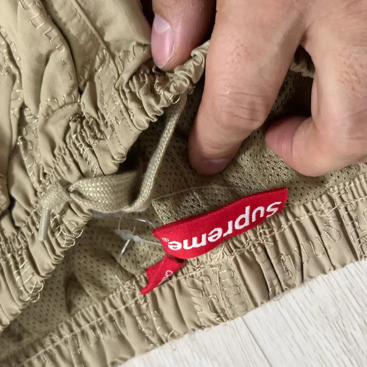 [BUNJANG] Supreme Repeat Embroidered Track Pants Tan / 슈프림 리핏 자수 트랙 팬츠 탄 유니크팬츠