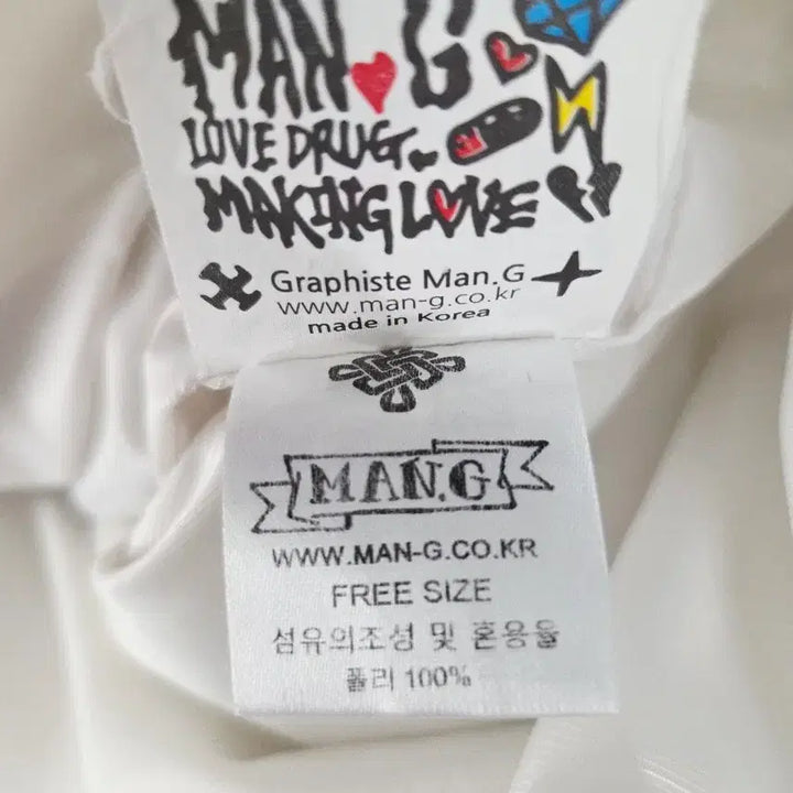 [BUNJANG] Graphiste Man.G White Embroidered Graphic Coach Jacket / Graphiste Man.G (만지) 화이트 자수 그래픽 코치 자켓