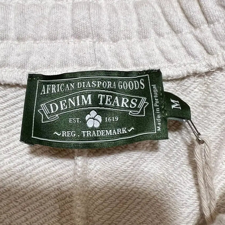 [BUNJANG] Denim Tears Rhinestone Cotton Wreath Sweatpants / [M] 데님 티어스 라인스톤 잼스톤 코튼 리쓰 스웨트팬츠 오트밀