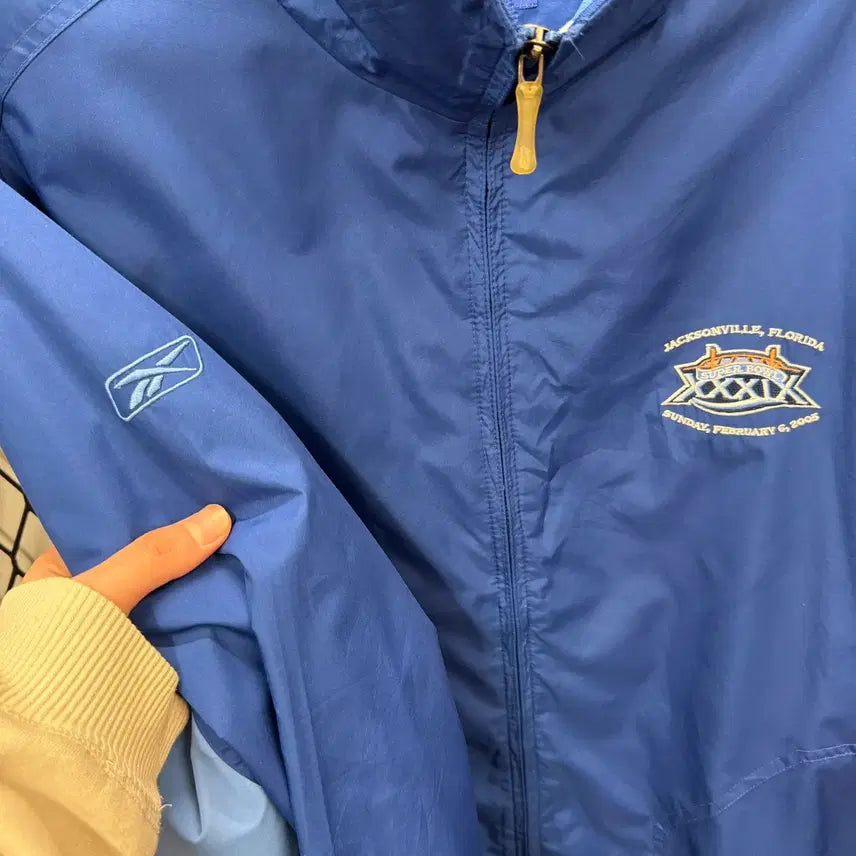 [BUNJANG] Reebok NFL Super Bowl Windbreaker Jacket / 00s 리복 X NFL 39회 슈퍼볼 바람막이 후면 로고 포인트 블루
