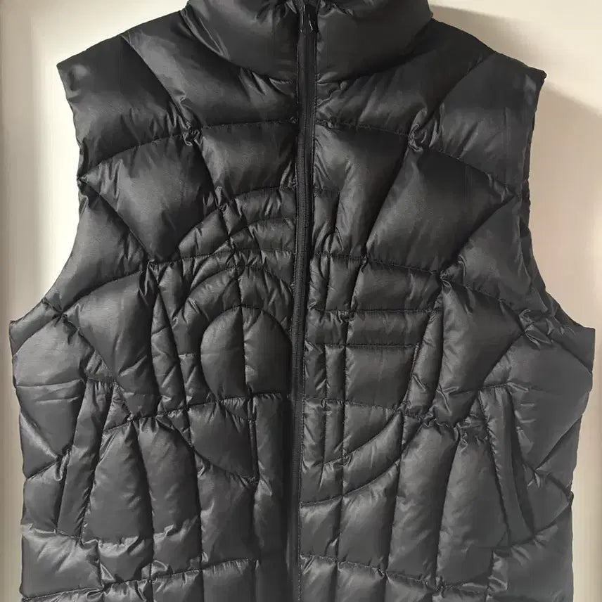 [SOLD OUT] 노매뉴얼 STITCHED SYMBOL PADDING VEST