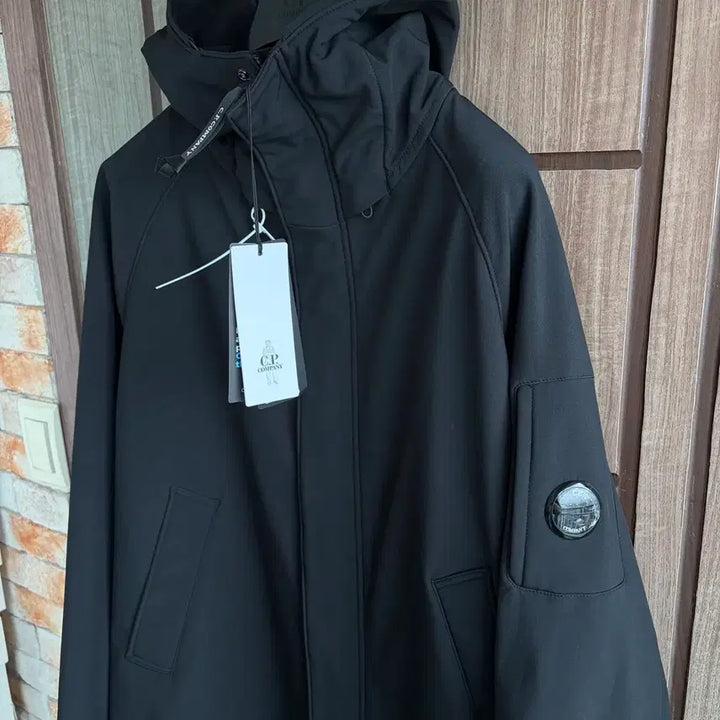 [BUNJANG] CP Company Lens Logo Hooded Long Jacket / 새상품(L)씨피컴퍼니 CP컴퍼니 렌즈 로고 후드 롱 자켓 블랙