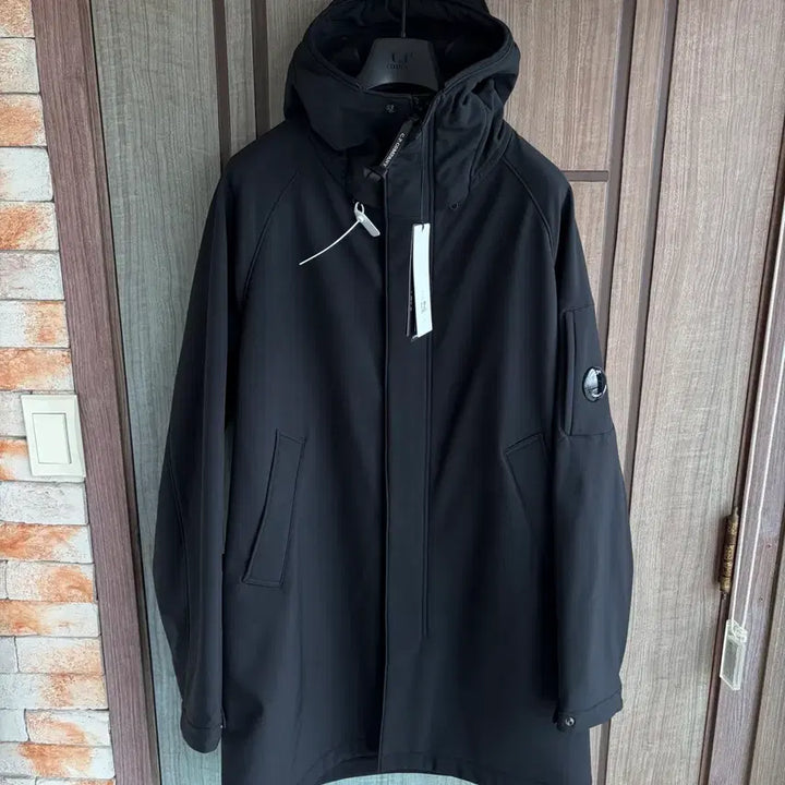 [BUNJANG] CP Company Lens Logo Hooded Long Jacket / 새상품(L)씨피컴퍼니 CP컴퍼니 렌즈 로고 후드 롱 자켓 블랙