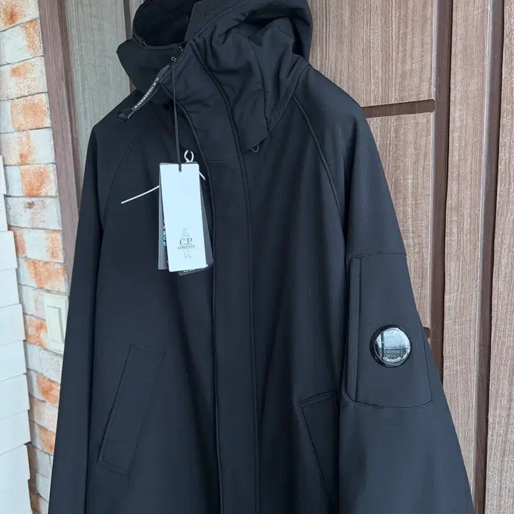 [BUNJANG] CP Company Lens Logo Hooded Long Jacket / 새상품(L)씨피컴퍼니 CP컴퍼니 렌즈 로고 후드 롱 자켓 블랙
