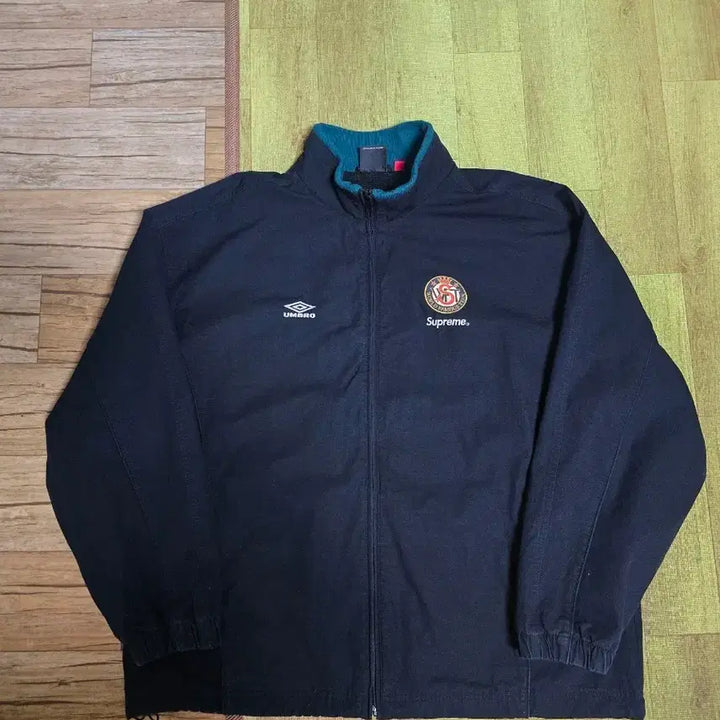 [SOLD OUT] 슈프림 x 엄브로 코튼 립스탑 트랙 자켓 블랙 - 23FW