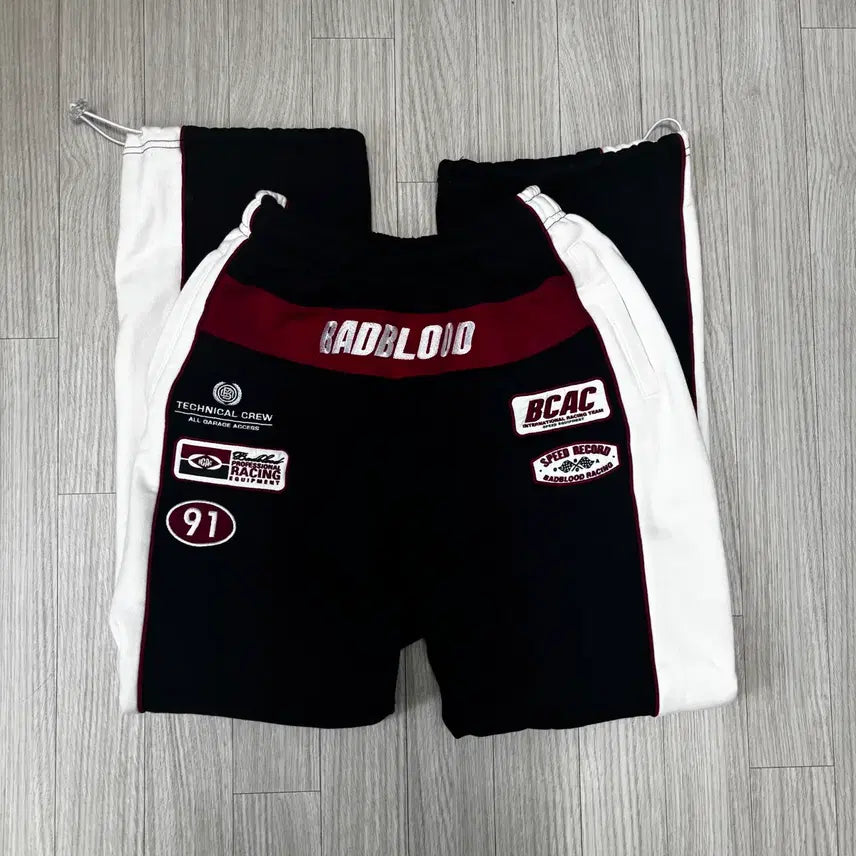 [SOLD OUT] 배드블러드 BCAC 레이싱 와이드 투웨이 조거 XS