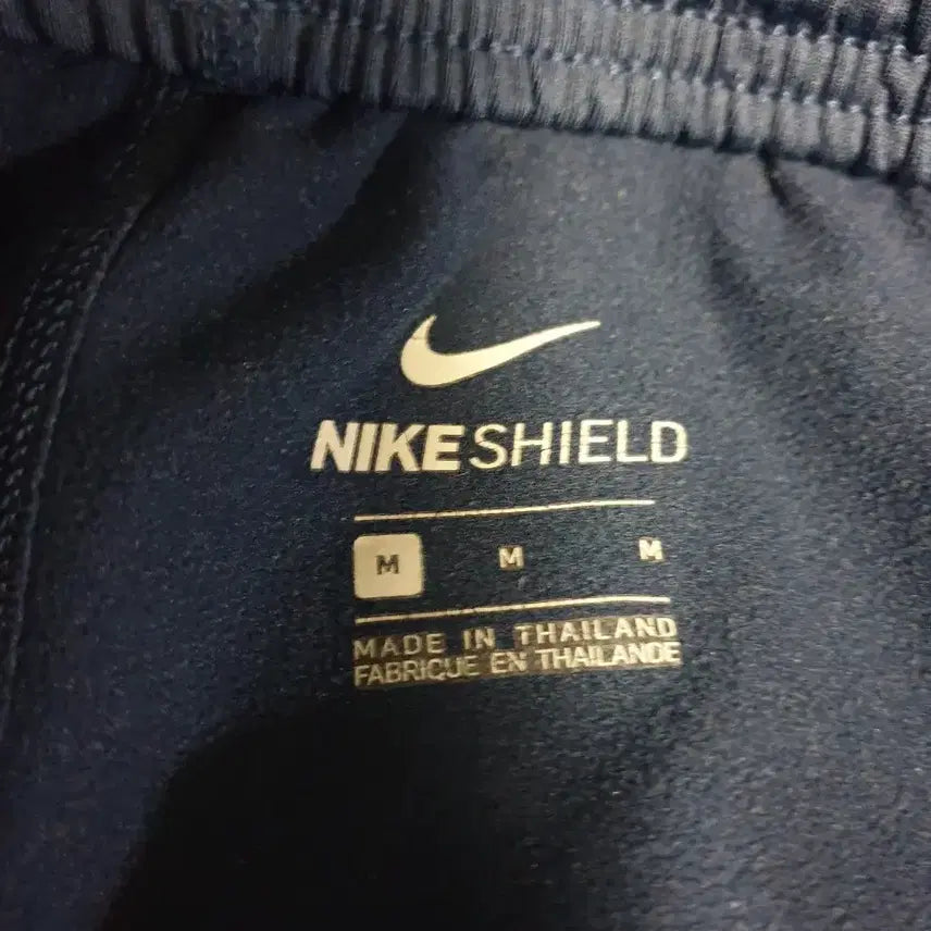 [BUNJANG] Nike Shield Solo Swoosh Woven Jogger Pants (Navy, M) / 나이키 쉴드 솔로스우시 밑단집업 우븐 조거팬츠 네이비 (M)