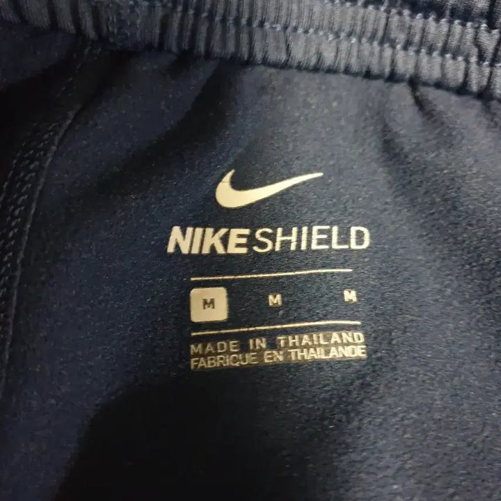 [BUNJANG] Nike Shield Solo Swoosh Woven Jogger Pants (Navy, M) / 나이키 쉴드 솔로스우시 밑단집업 우븐 조거팬츠 네이비 (M)