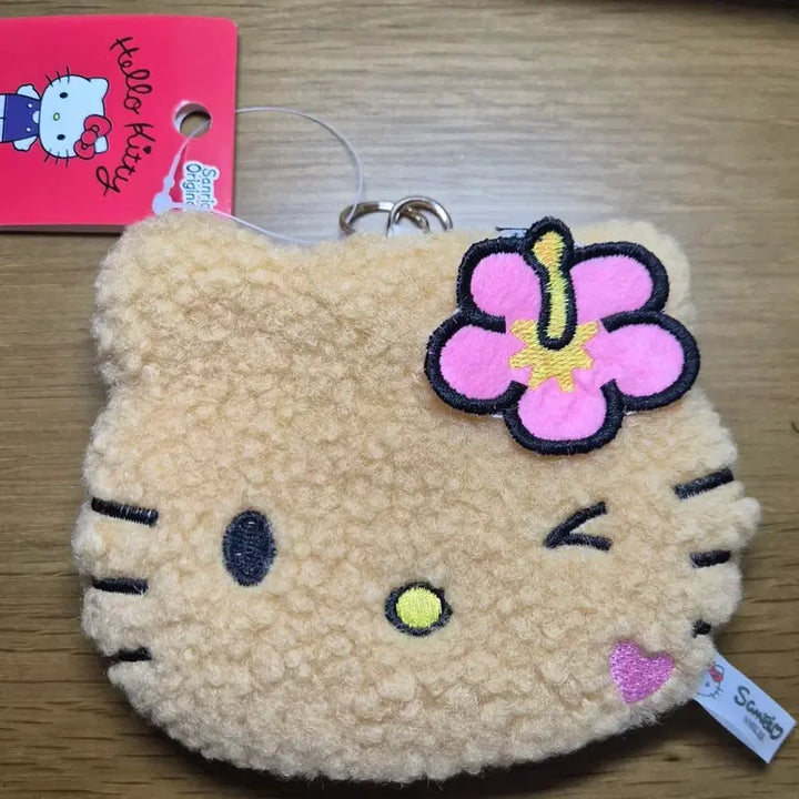 [BUNJANG] Sanrio Hello Kitty "Poonggi" Pouch Coin Purse with Keychain / 산리오 헬로키티 얼굴 뽀글이 파우치 동전지갑 키링/ 태닝키티
