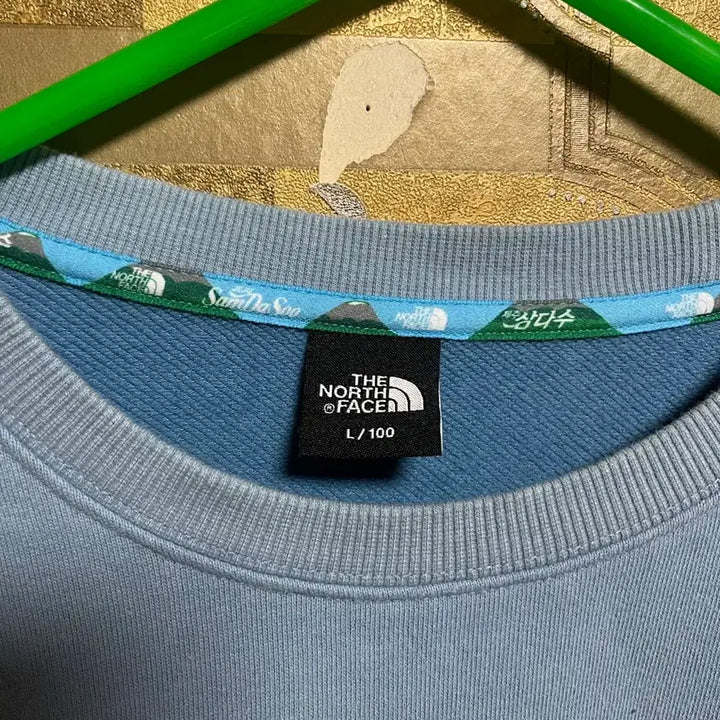[BUNJANG] The North Face x Samdasoo Collaboration Sky Blue Sweatshirt / [ 노스페이스X삼다수 콜라보 맨투맨 L/100 ]