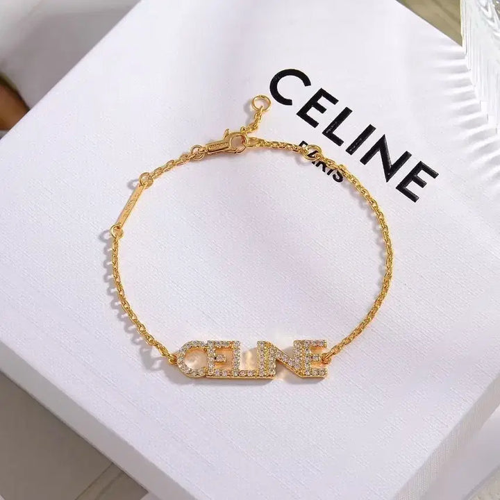 [SOLD OUT] 셀린 큐빅 레터링 팔찌 금장