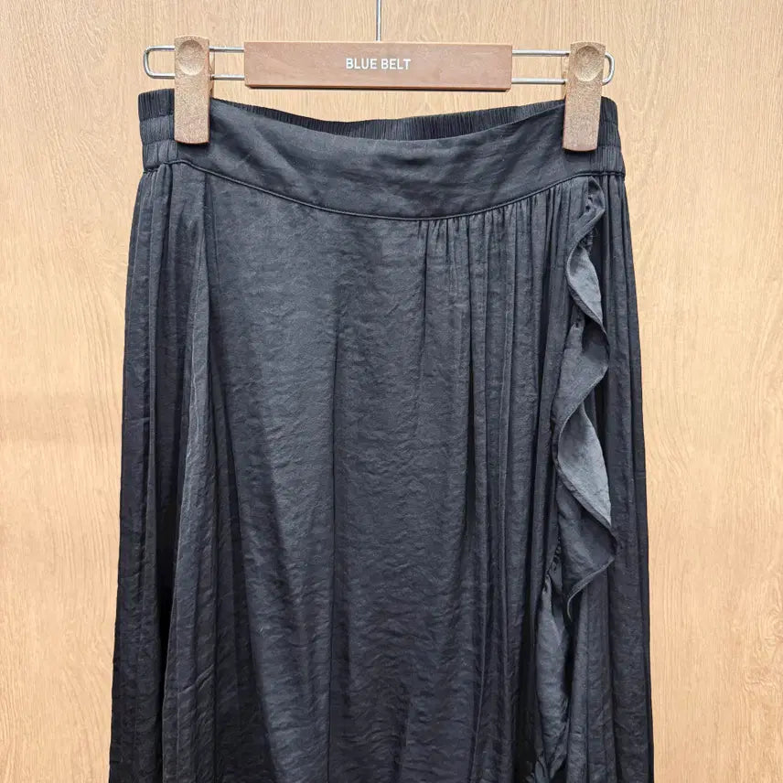 [BUNJANG] Maje Asymmetrical Wrap Long Skirt with Frill Detail - Black / 마쥬 언발란스 랩스타일 밴딩 롱 스커트 프릴 레이어드 디테일 블랙