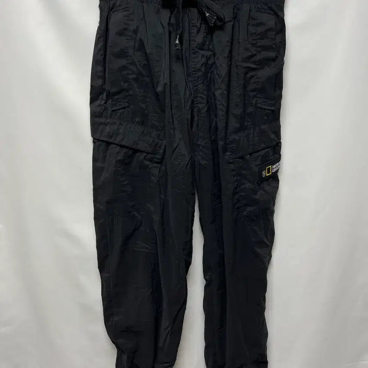 [SOLD OUT] [정품/76] 내셔널지오그래픽 와펜 블랙 우븐 조거 팬츠/바지