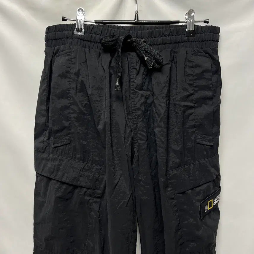 [SOLD OUT] [정품/76] 내셔널지오그래픽 와펜 블랙 우븐 조거 팬츠/바지