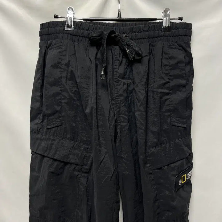 [SOLD OUT] [정품/76] 내셔널지오그래픽 와펜 블랙 우븐 조거 팬츠/바지