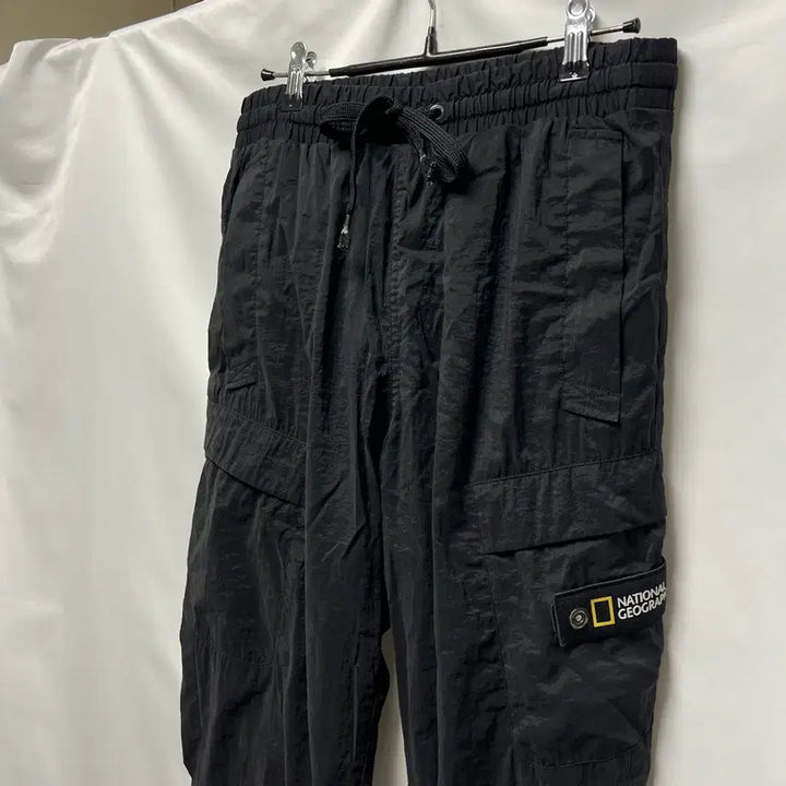[SOLD OUT] [정품/76] 내셔널지오그래픽 와펜 블랙 우븐 조거 팬츠/바지