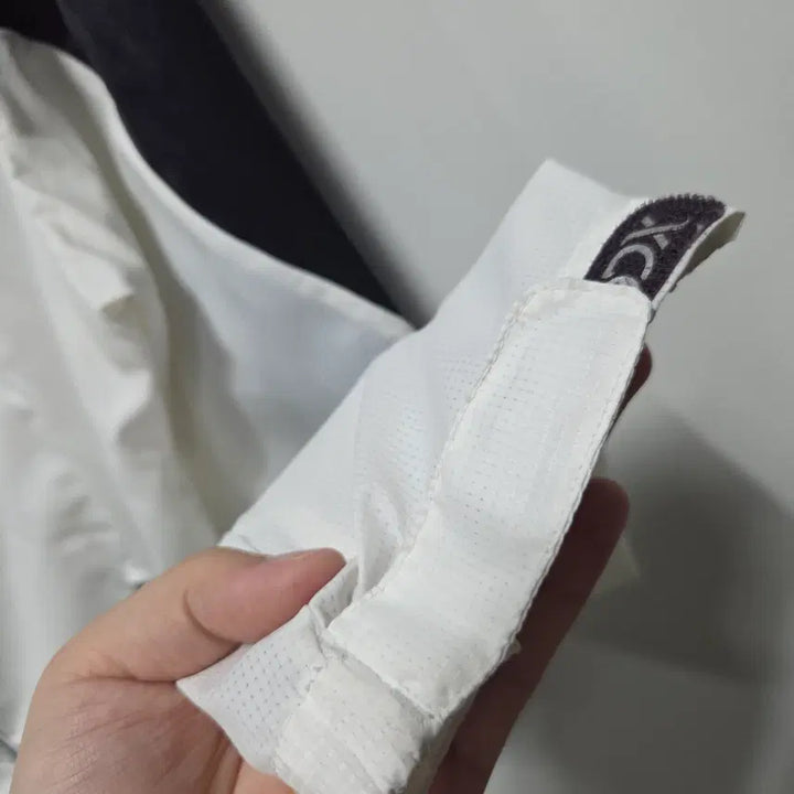 [SOLD OUT] 디스커버리 컬러블록 경량 바람막이 자켓 100 26041705