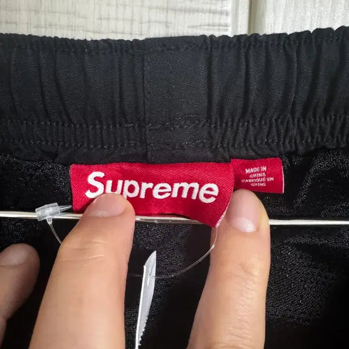 [BUNJANG] Supreme Spellout Embroidered Ripstop Track Pants Black FW25 / 슈프림 스펠아웃 자수 립스탑 트랙 팬츠 블랙 - 25FW