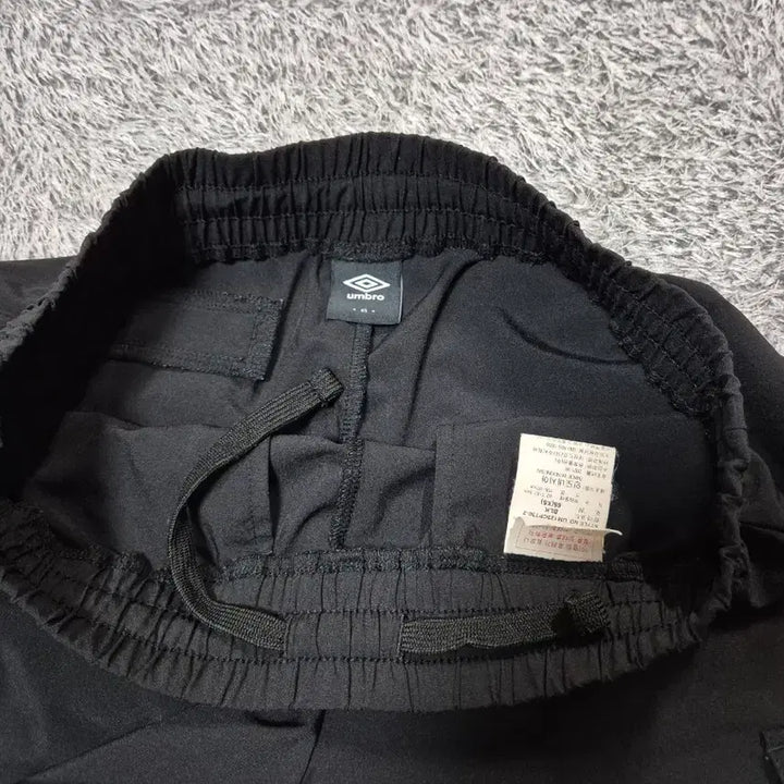 [SOLD OUT] 엄브로 여성 우븐 카고 조거팬츠 65(XS)