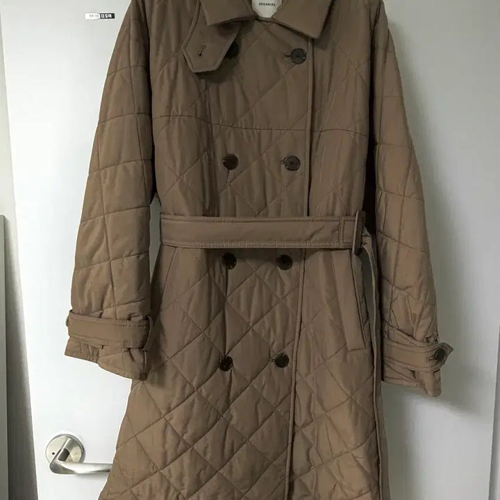 [BUNJANG] Shesmiss Quilted Long Padding (Milk Brown) / [쉬즈미스] 퀄팅 허리 롱패딩 (밀크브라운)
