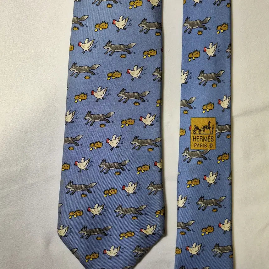 [BUNJANG] Hermes Sky Blue Fox and Chicken Pattern Silk Tie / 에르메스 스카이블루 여우 닭패턴 실크 넥타이