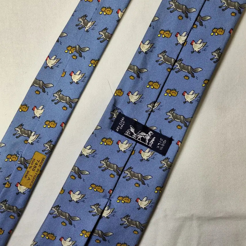[BUNJANG] Hermes Sky Blue Fox and Chicken Pattern Silk Tie / 에르메스 스카이블루 여우 닭패턴 실크 넥타이