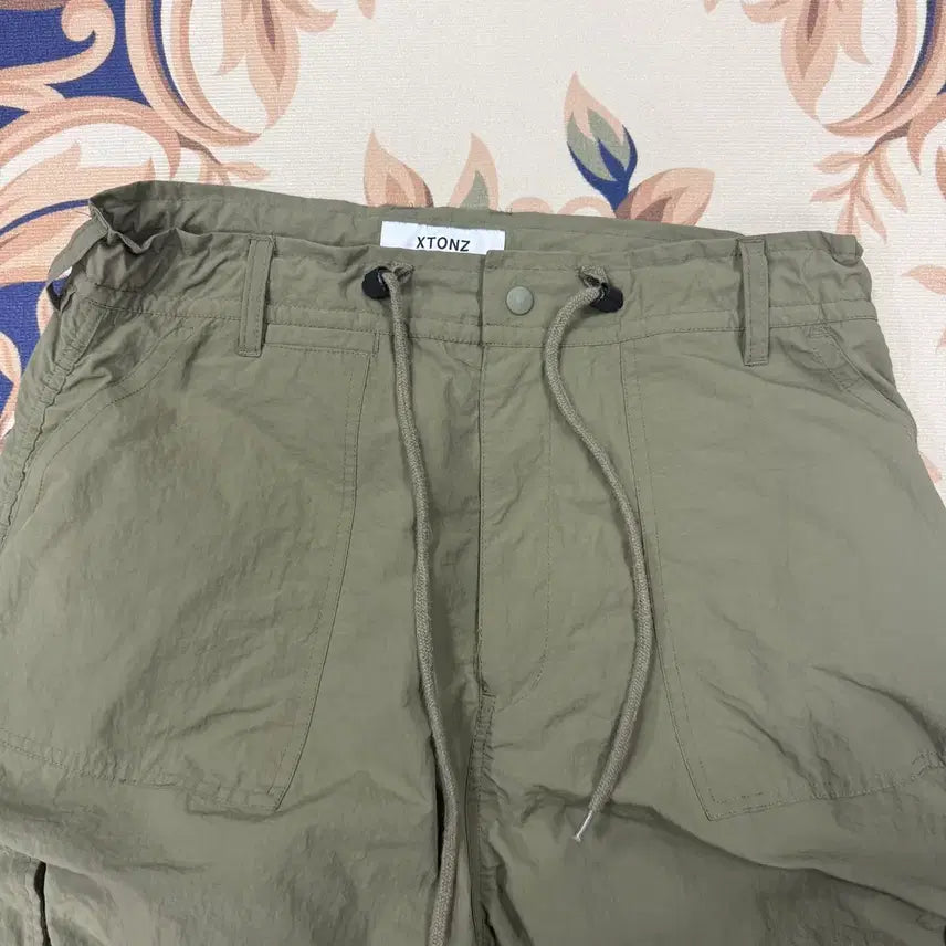 [SOLD OUT] (L)엑스톤즈 XTONZ 우븐 카고셔링팬츠(카키)
