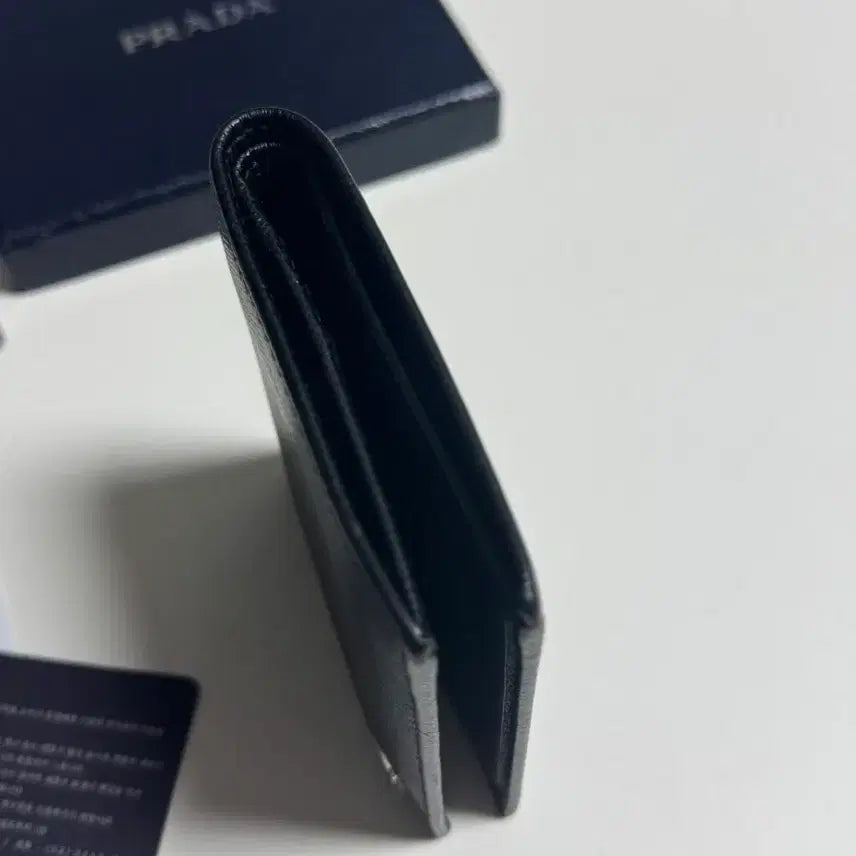 [BUNJANG] Prada Saffiano Side Logo Bi-fold Wallet Black / 프라다 사피아노 사이드로고 반지갑 블랙