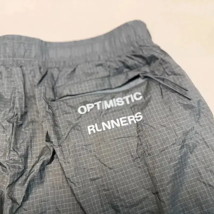 [BUNJANG] Optimistic Runners Glossy Ripstop Shorts Metallic Grey / 옵티미스틱 러너스 글로시 립스탑 쇼츠  판매