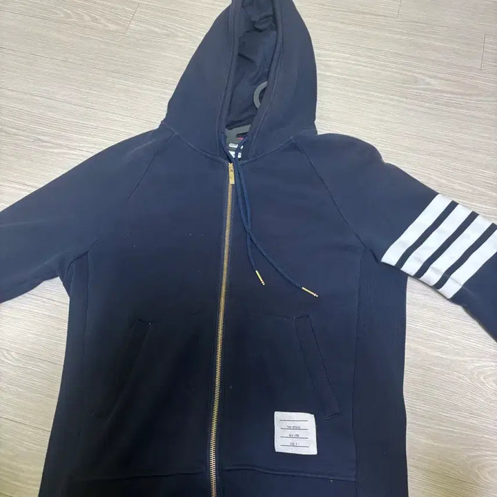 [BUNJANG] Thom Browne Striped Armband Gold Button Hoodie Zip-up / 톰브라운 사선완장 금장 후드집업 판매