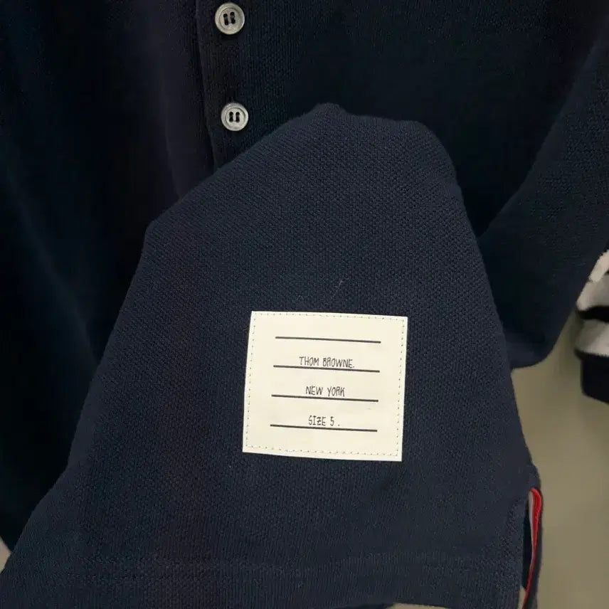 [BUNJANG] Thom Browne Striped Sleeve Waffle Collar Polo Shirt Size 5 / 톰브라운 사선 완장 와플 카라티 5사이즈