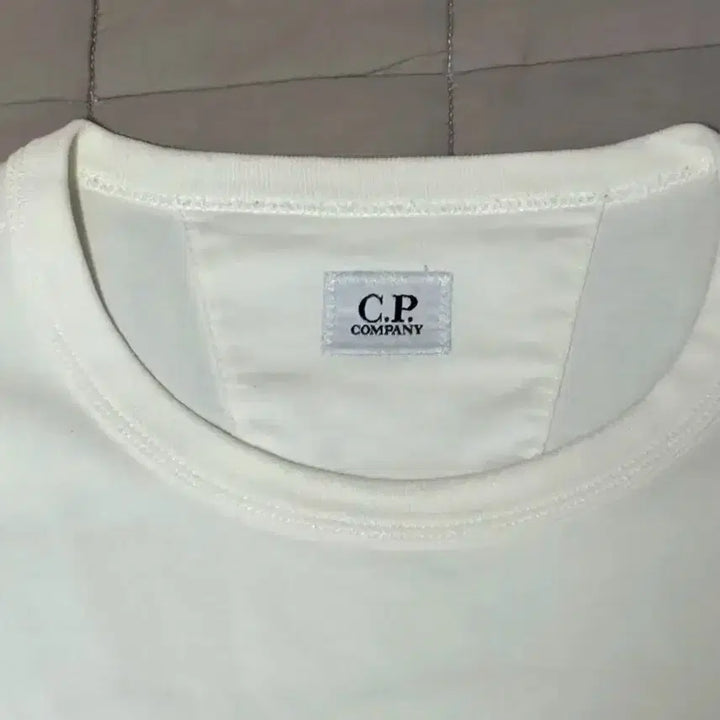 [BUNJANG] CP Company White Lens T-Shirt / CP컴퍼니 화이트 렌즈 반팔 티셔츠(L)