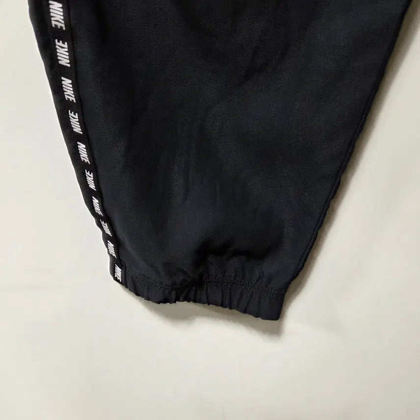 [BUNJANG] Nike Taping Logo Woven Training Pants (M) / 나이키 테이핑 로고 우븐 트레이닝 팬츠 M 26050720