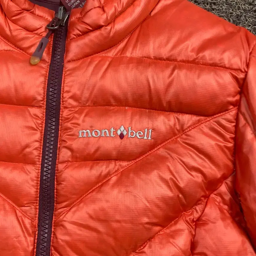 [BUNJANG] Montbell Embroidered Logo Wind Orange Quilting Lightweight Padded Jacket / 몽벨 자수로고 윈드 오렌지 퀼팅 경량 패딩