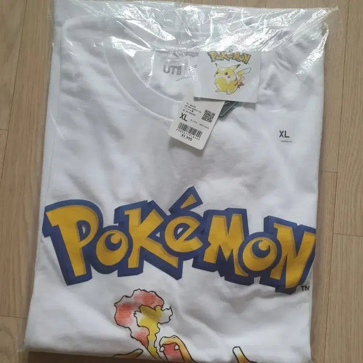 [BUNJANG] Uniqlo Pokemon Charizard Short Sleeve T-Shirt XL / 유니클로 uniqlo 포켓몬스터 pokemon 리자몽 반팔 티셔츠