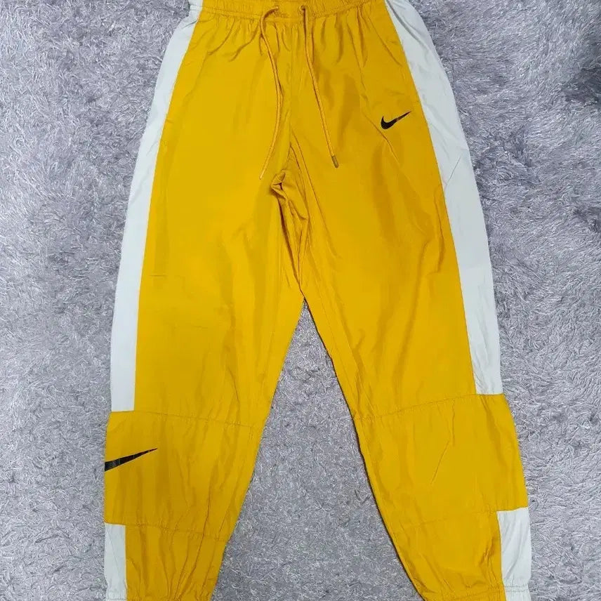 [BUNJANG] Nike Repel Essential Mid-Rise Woven Jogger Pants Yellow / 나이키 바지 리펠 에센셜 미드라이즈 우븐 조거 팬츠 옐로우 s