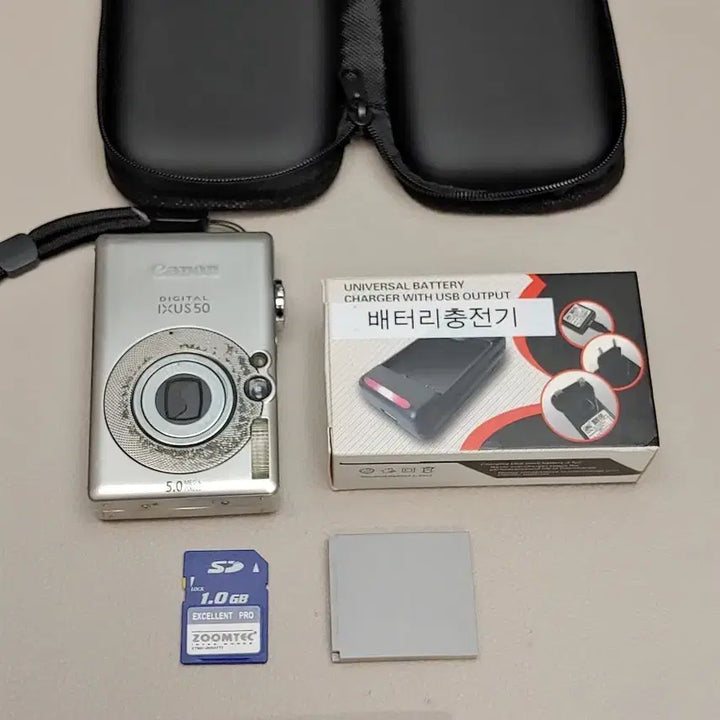 [BUNJANG] Canon Digital IXUS 50 Camera Kit with Charger, SD Card, and Pouch / 캐논 디지털 IXUS 50 카메라 본체 + 충전기 + SD카드 + 파우치