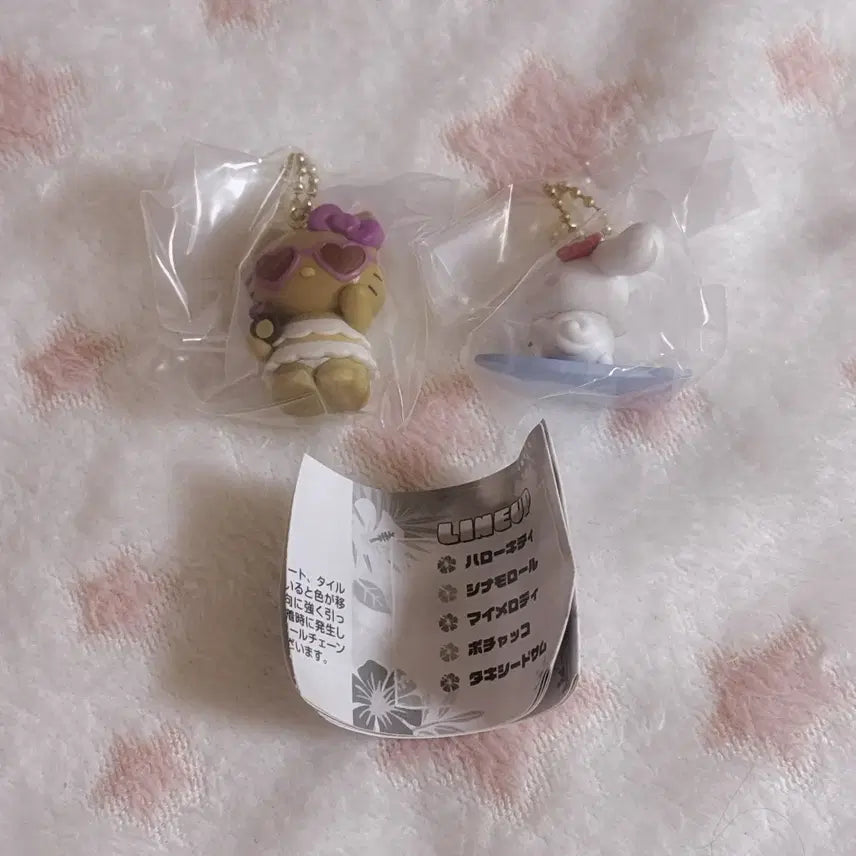 [BUNJANG] Sanrio Tanning Swing Keychain Gacha Set (Kitty, Cinnamoroll) / 산리오 태닝 스윙 키링 가챠 키티 시나모롤 세트